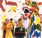 Lion dancers performe to the beat of drums and gongs